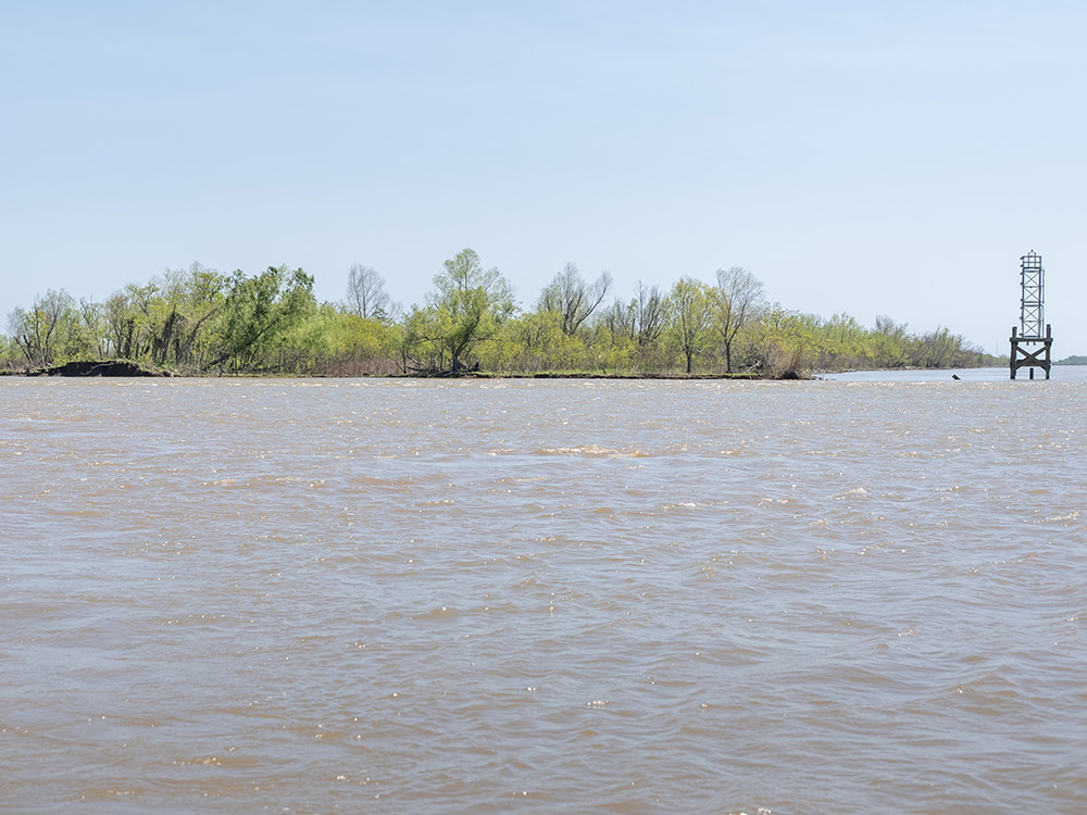 river channel marker and breached levee and open water