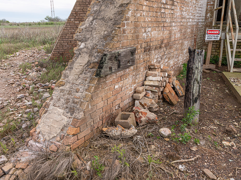 large brick buttresses support the Sabine Pass Lighthouse