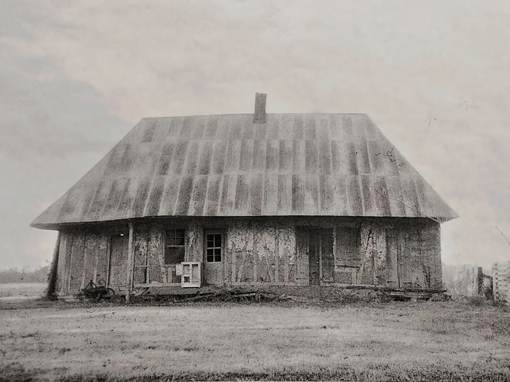 old black and white photo of Roque house