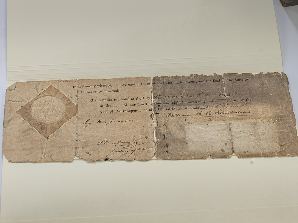 aged document with writing, signatures and seal