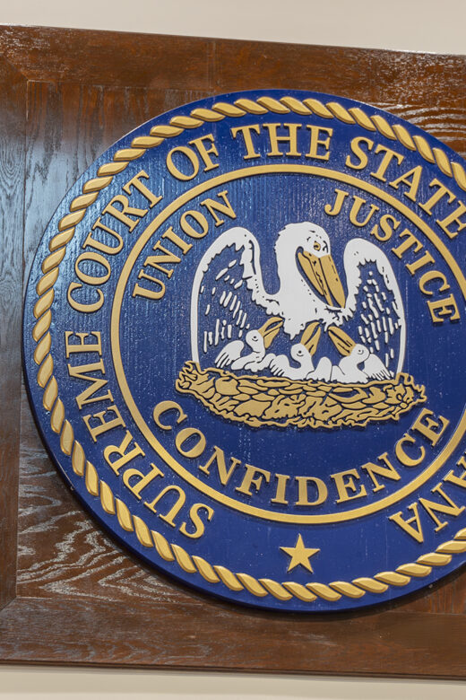 Official seal of Louisiana with white pelican and motto Union Justice Confidence on blue background