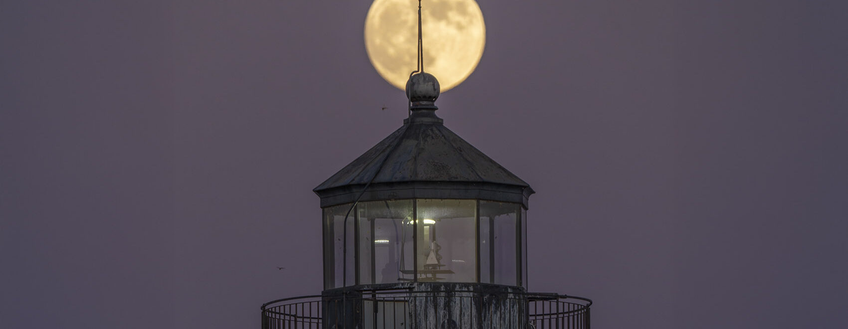 supermoon and lighthouse