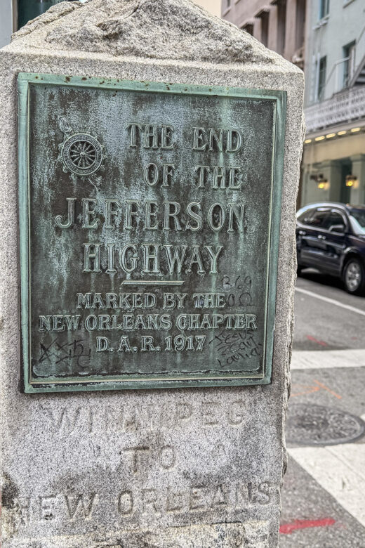 granite monument with metal sign commemorating Jefferson Highway