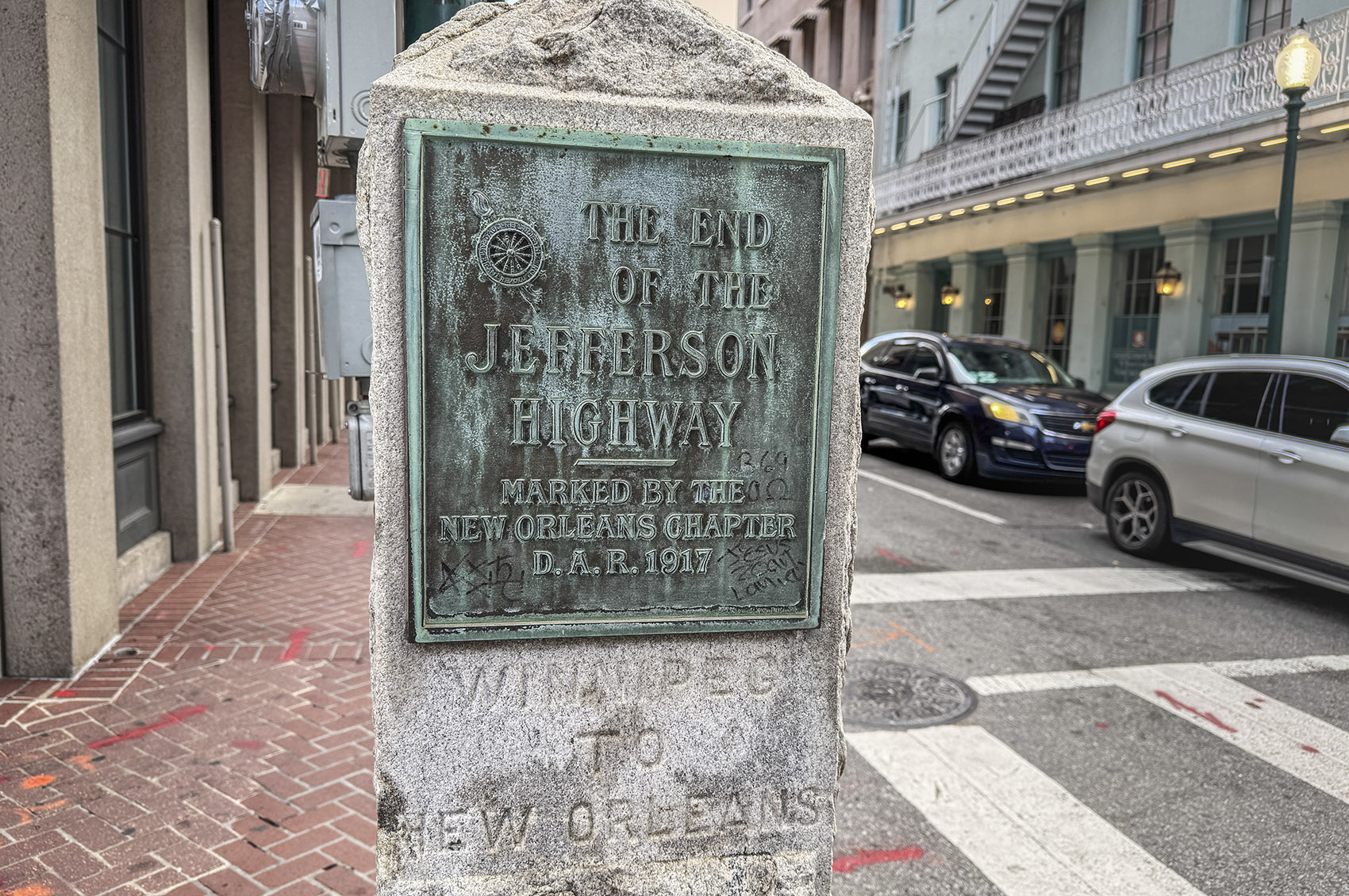 granite monument with metal sign commemorating Jefferson Highway