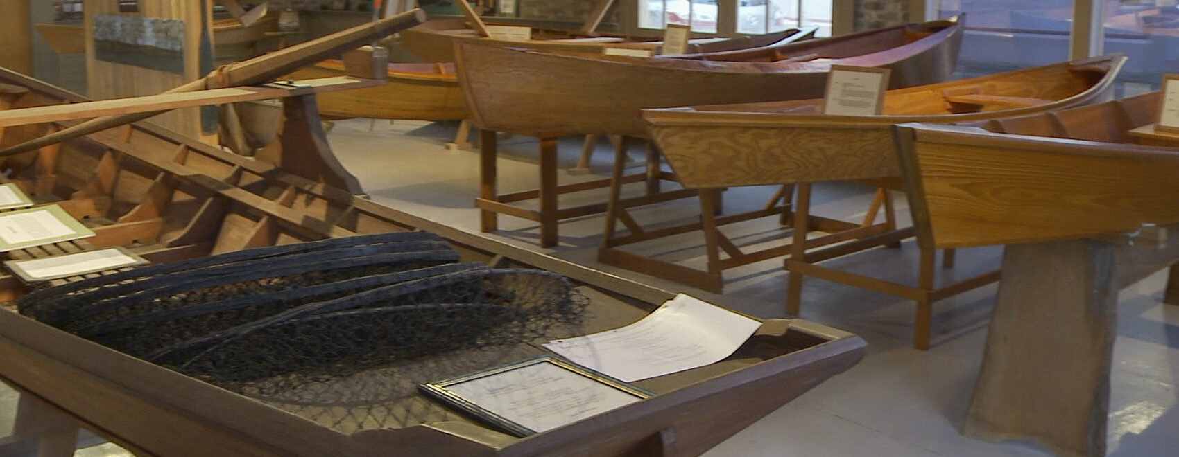 small wooden Cajun style boats in museum