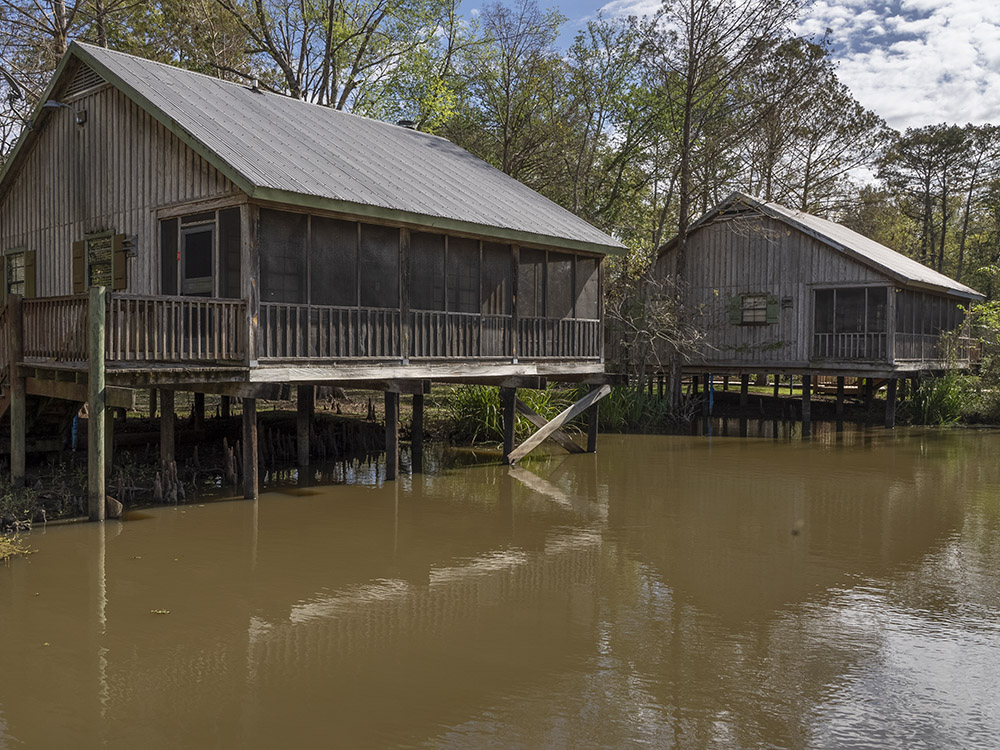 waterfront wood cabins on the water at Lake Fausse Pointe State Park