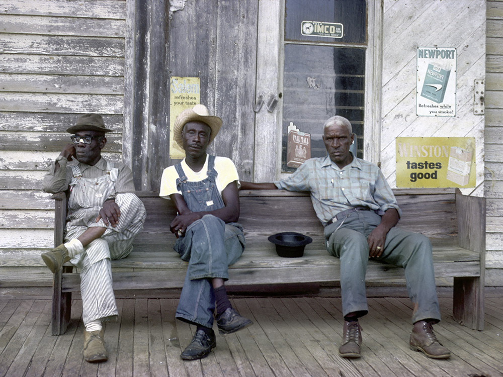 elderly black men sitting on porch bench