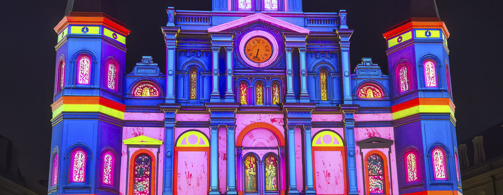 colorful light show projected on cathedral