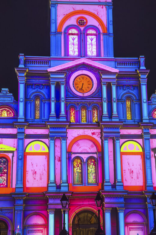 colorful light show projected on cathedral