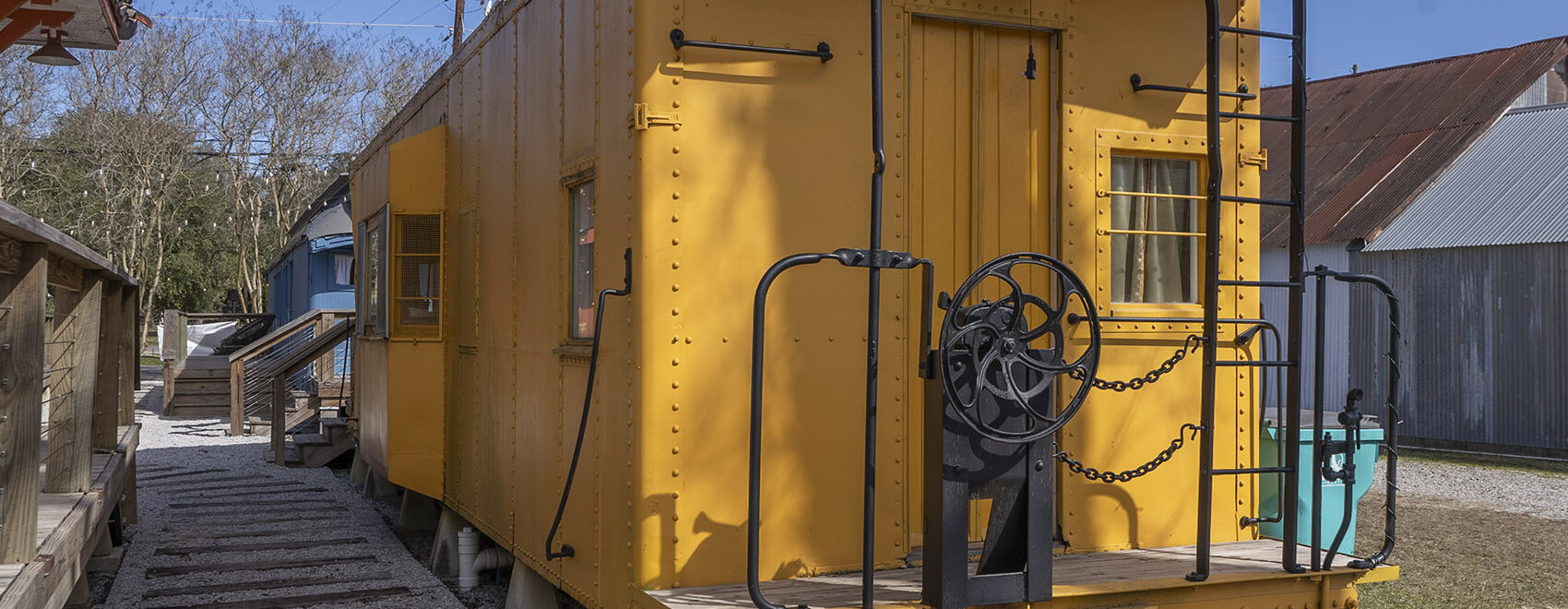 yellow caboose rail car