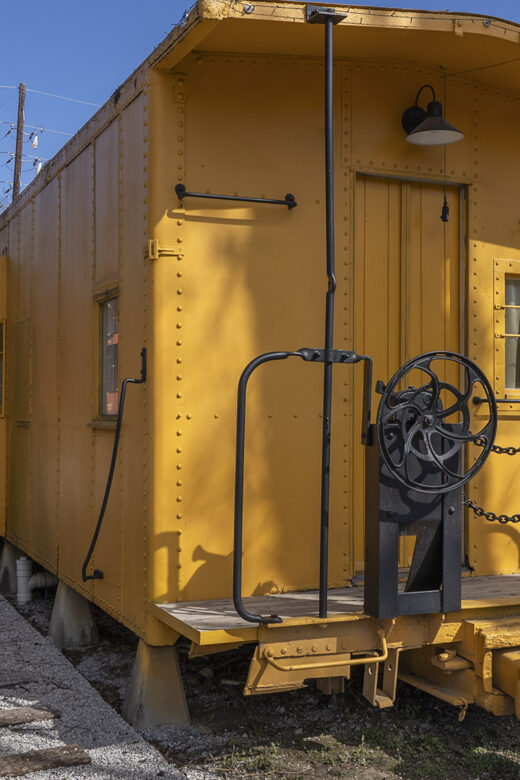 yellow caboose rail car