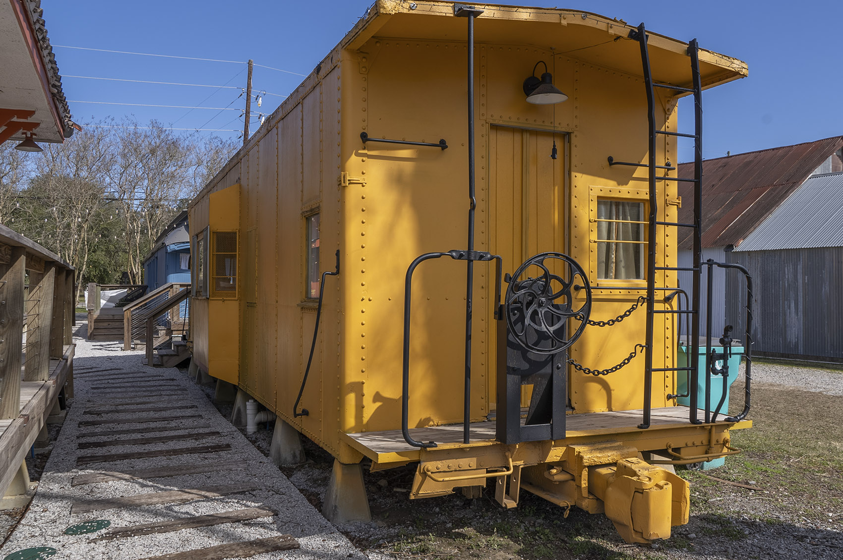 yellow caboose rail car