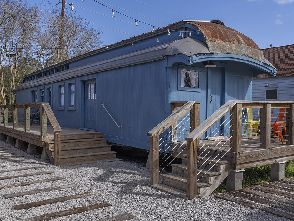 blue railroad car with steps at Train Wreck Inn
