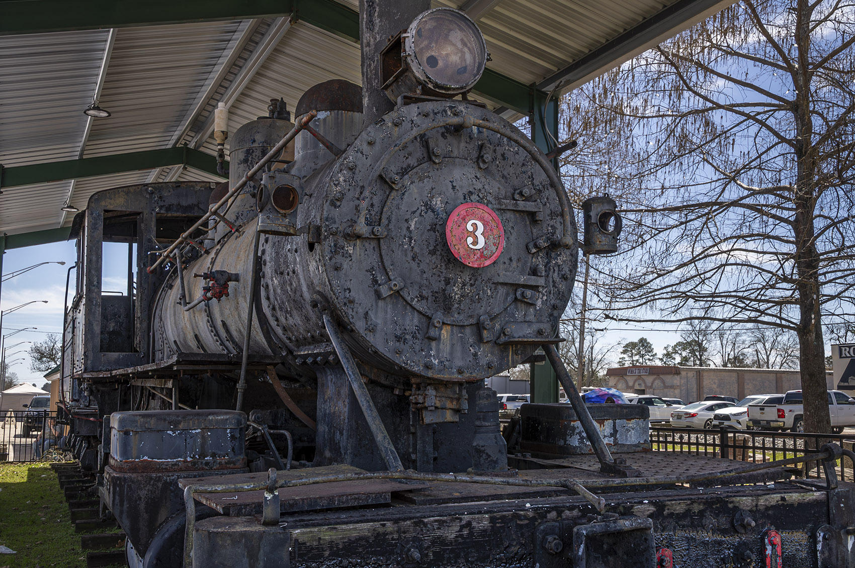 old black colored railroad engine with number 3