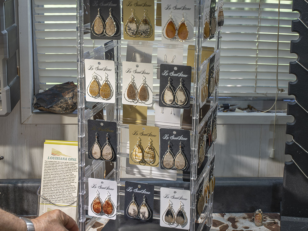earrings made with Louisiana gemstones hanging on display rack