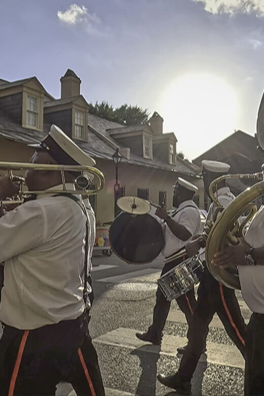 brass band parades through french quarter in New Orleans