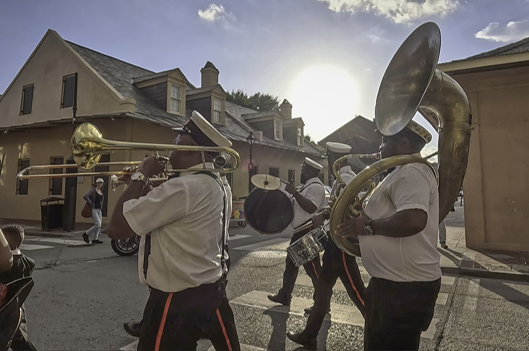 brass band parades through french quarter in New Orleans
