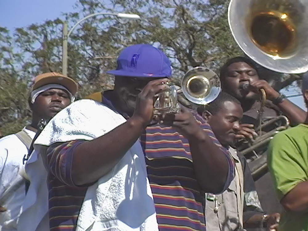 brass band playing music in Katrina damaged neighborhood
