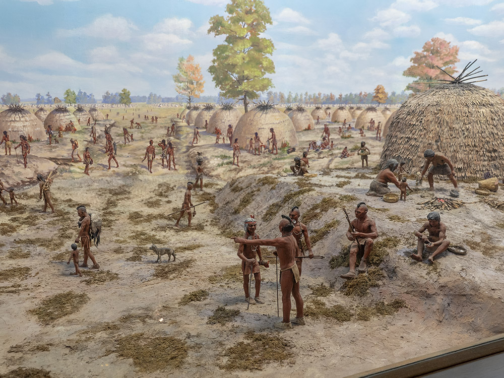 diorama of native people in large settlement