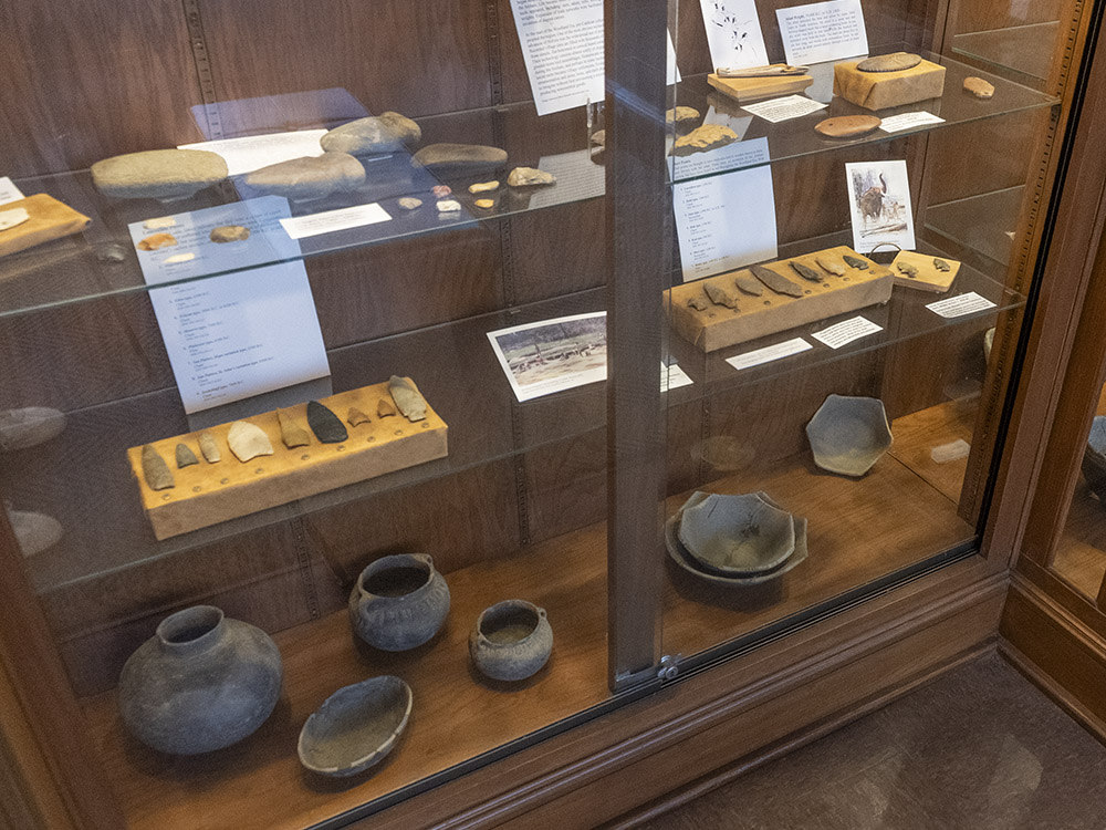 native pottery and other artifacts in display case