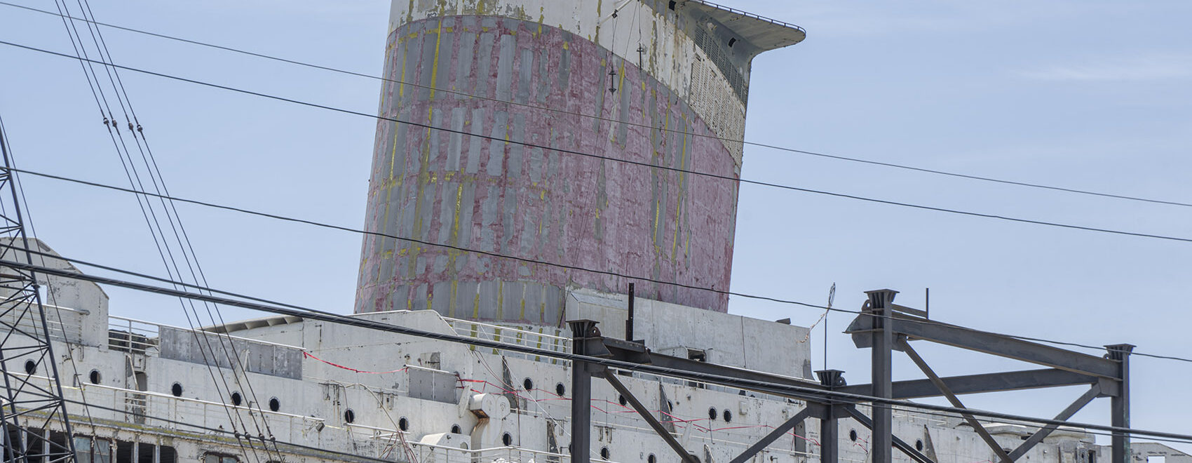 rusting stack of old cruise ship.