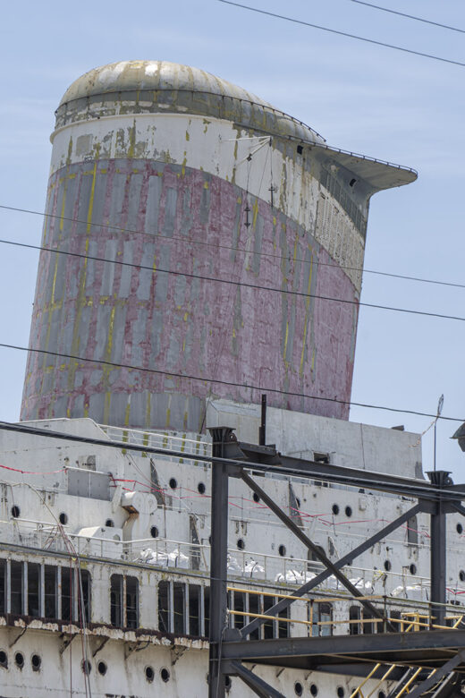 rusting stack of old cruise ship.