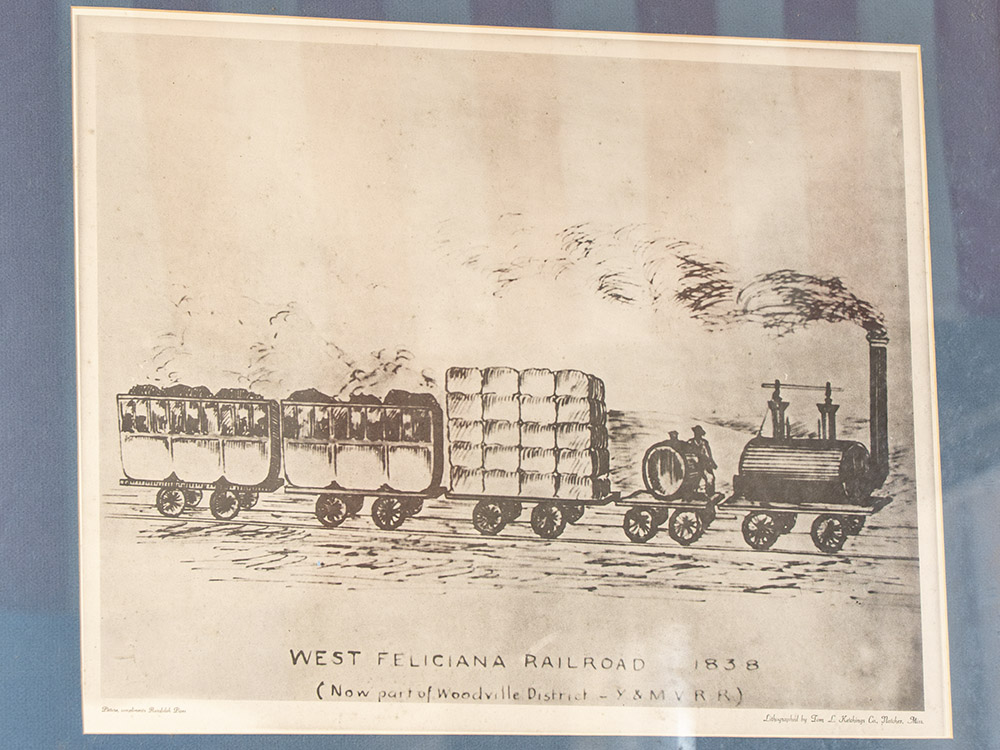 drawing of an 1830's railroad engine pulling freight and passenger cars