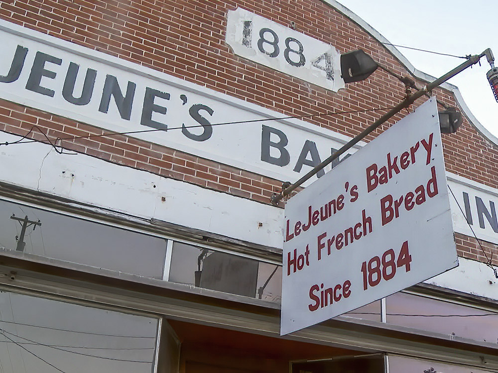 old brick building with 1884 date and handing sign for LeJeune's Bakery
