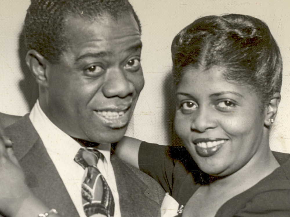 black and white photo of man and woman in dress clothes
