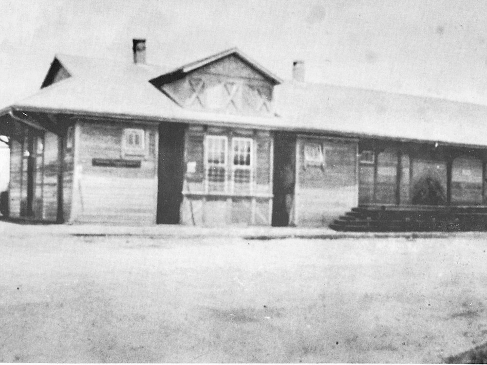 black and white photo of old railroad depot