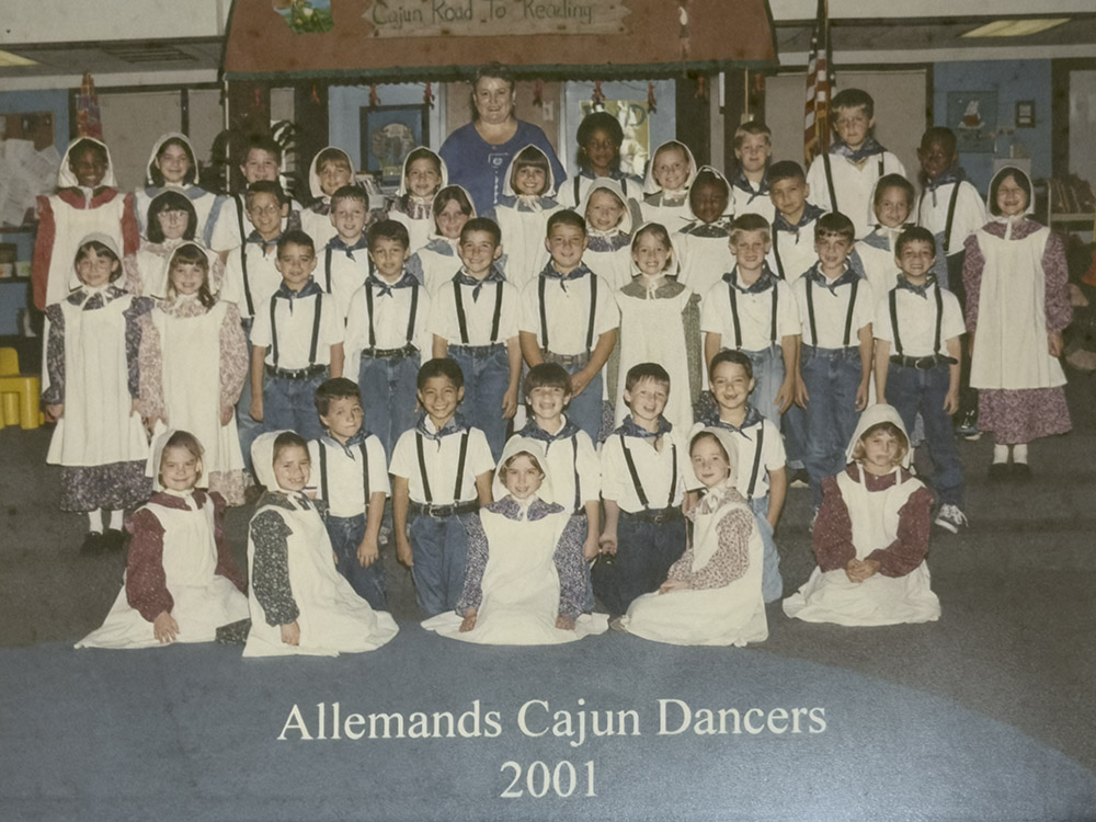 picture of young students in dance uniforms with caption Allemands Cajun Dancers 2001