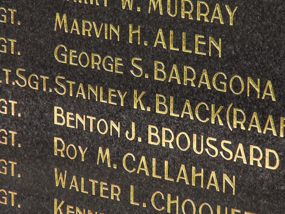 names of soldiers killed in battle on stone memorial
