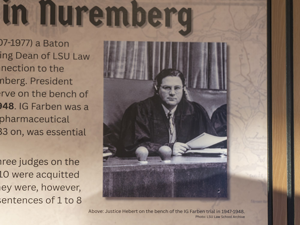 black and white photo of man identified as justice Paul Hebert in museum display