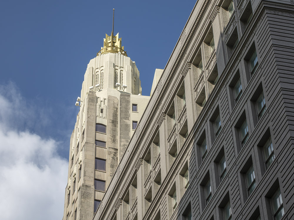 23 story building with gold-colored top of its tower