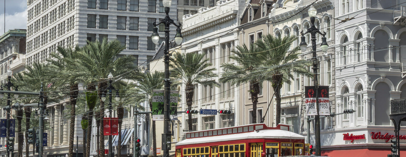 New Orleans historic buildigs and red street car on canal street