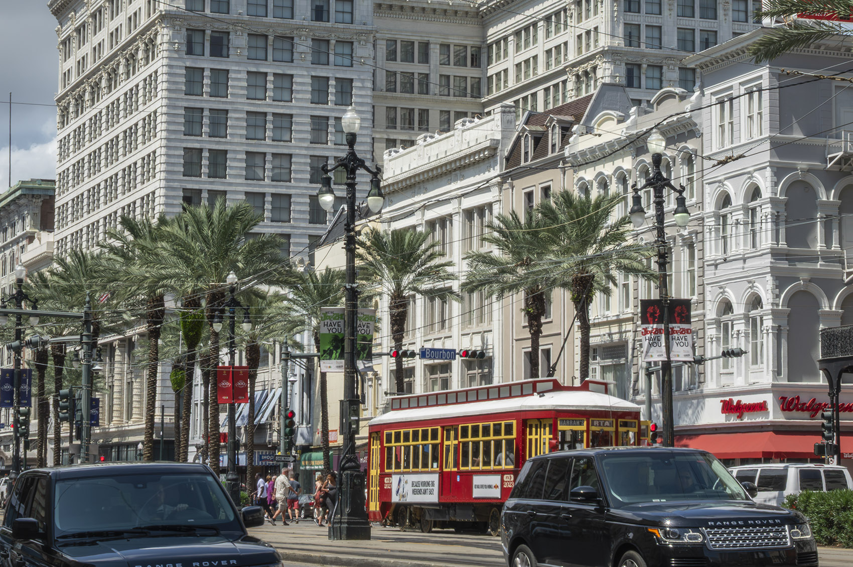 New Orleans historic buildigs and red street car on canal street