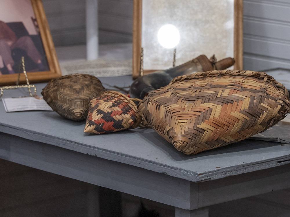 hand-woven choctaw baskets on table in Lacombe museum
