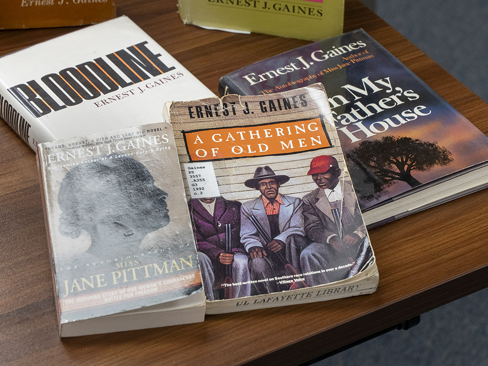 books by ernest gaines laying on table